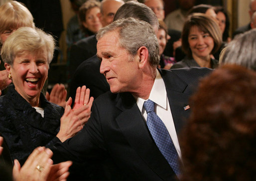 President George W. Bush reaches into the audience to shake hands with invited guests and staff members following his farewell address to the nation Thursday evening, Jan. 15, 2009 in the East Room of the White House, where President Bush thanked the American people for their support and trust. White House photo by Joyce N. Boghosian