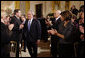 President George W. Bush grasps hands with Former Homeland Security Advisor, Tom Ridge, as he receives applause following his address to the nation Thursday evening, Jan. 15, 2009, from the East Room of the White House. White House photo by Eric Draper