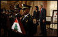 President George W. Bush and U.S. Secretary of State Condoleezza Rice stand during a presentation oft he Color Guard and the playing of the national anthem Thursday, Jan. 15, 2009, during a ceremony at the U.S. Department of State commemorating foreign policy achievements. White House photo by Eric Draper