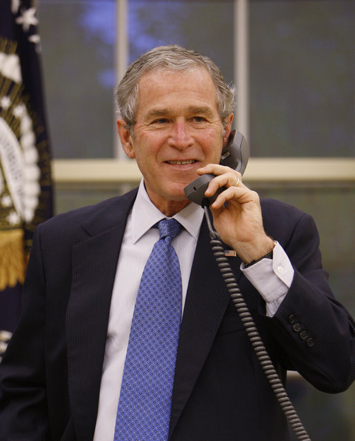 President George W. Bush is seen Monday morning in the Oval Office Jan.19. 2009, making phone calls to current and former world leaders during his final full day in office. White House photo by Eric Draper