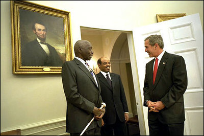  President George W. Bush welcomes President Daniel arap Moi of Kenya and Prime Minister Meles Zenawi of Ethiopia to the Oval Office Dec. 5, 2002. These leaders, who are friends and allies of America, have joined in global war on terror. President Bush stressed the global reach of the war and noted that if the terrorists could strike in Kenya, they could strike in Ethiopia or anywhere.