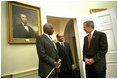  President George W. Bush welcomes President Daniel arap Moi of Kenya and Prime Minister Meles Zenawi of Ethiopia to the Oval Office Dec. 5, 2002. These leaders, who are friends and allies of America, have joined in global war on terror. President Bush stressed the global reach of the war and noted that if the terrorists could strike in Kenya, they could strike in Ethiopia or anywhere.