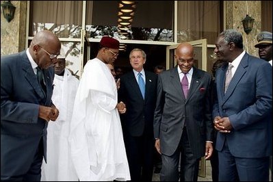 President George W. Bush departs a meeting with leaders of Western African democracies at the Presidential Palace in Dakar, Senegal, Tuesday morning, July 8, 2003. Leaders present in the meeting were from Benin, Cape Verde, Gambia, Ghana, Mali, Niger, Senegal and Sierra Leone. 