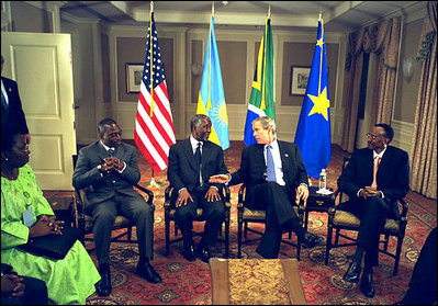 President George W. Bush meets with President Joseph Kabila of the Democratic Republic of Congo, left, President Thabo Mbeki of South Africa, center, and President Paul Kagame of Rwanda, right, at the Waldorf-Astoria Hotel in New York City Sept. 13, 2002. President Bush joined President Mbeki, Chairman of the African Union, to promote stability in the Great Lakes region and urged President Kagame to end support to Congolese rebel groups and begin withdrawal from Congo. President Bush also called on President Kabila to end support to the Rwandan rebels and arrest genocide suspects who had sought refuge in the Democratic Republic of the Congo. President Kagame announced that same afternoon that Rwandan forces would withdraw from Congo.