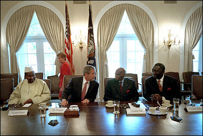 President George W. Bush talks with President Abdoulaye Wade of Senegal, center, as President Oumar Konare of Mali, left, and President John Kufuor of Ghana, right, listen during a meeting in the Cabinet Room June 28, 2001. President Bush met with these heads of state of Africa's promising democracies to affirm their shared opposition to governments that come to power by unconstitutional means. President Bush expressed appreciation for the participation of Ghana, Senegal and Mali in U.S. initiatives, such as the African Crisis Response Initiatives and Operation Focus Relief.