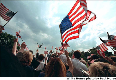 As Marine One takes off from the South Lawn, well-wishers bid farewell with a barrage of flags Sept. 21. White House photo by Paul Morse.