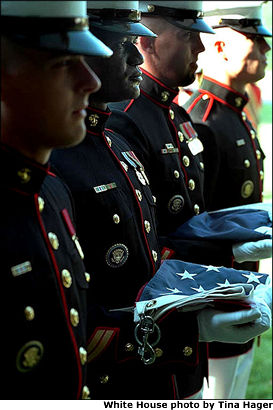 Marines conduct a flag-raising ceremony for President Bush and Mrs. Bush on a quiet Sunday at Camp David, Sept. 23. White House photo by Tina Hager.