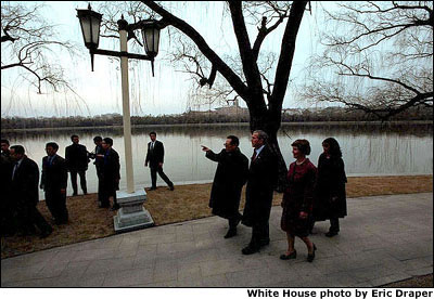 President Bush and Mrs. Bush walk with Chinese President Jiang Zemin at the Zhongnanhai leadership compound in Beijing, Friday, Feb. 22, 2002. 