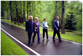 President Bush and Laura Bush walk with President Putin and his wife, Lyudmila, during a visit to the Novo-Ogarevo residence outside Moscow, Russia’s version of America’s Camp David, May 24.