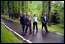 President Bush and Laura Bush walk with President Putin and his wife, Lyudmila, during a visit to the Novo-Ogarevo residence outside Moscow, Russia’s counterpart to America’s Camp David, May 24.