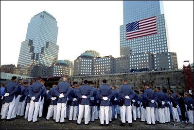 Cadets pay their respects to the victims of the World Trade Center disaster at Ground Zero in New York, Sept. 11, 2002. "For members of our military, it's been a year of sacrifice and service far from home," said the President. "For all Americans, it has been a year of adjustment, of coming to terms with the difficult knowledge that our nation has determined enemies, and that we are not invulnerable to their attacks."