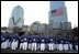 Cadets pay their respects to the victims of the World Trade Center disaster at Ground Zero in New York, Sept. 11, 2002. "For members of our military, it's been a year of sacrifice and service far from home," said the President. "For all Americans, it has been a year of adjustment, of coming to terms with the difficult knowledge that our nation has determined enemies, and that we are not invulnerable to their attacks."