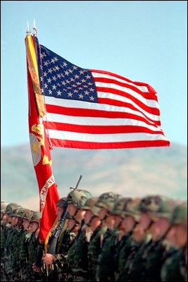 Welcoming President George W. Bush, marines carry the United States and Marine Corps flags at Camp Pendleton, Calif., May 29, 2001. "Camp Pendleton serves as the launching pad for what Marines do best.to deploy rapidly so you can be the first on the scene wherever freedom and America's interests are threatened," said the President. "Today, you carry forward this proud tradition, ready to answer when America calls."