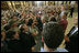 President greets U.S. troops and U.S. embassy personnel during his trip to Baghdad, Iraq, Tuesday, June 13, 2006. "This is a moment -- this is a time where the world can turn one way or the other, where the world can be a better place or a more dangerous place," said the President. "And the United States of America and citizens such as yourself are dedicated to making sure that the world we leave behind is a better place for all." White House photo by Eric Draper