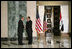 Prime Minister Nouri al-Maliki greets President George W. Bush upon his arrival to Baghdad, Iraq, Tuesday, June 12, 2006. White House photo by Eric Draper 