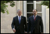 President George W. Bush walks with Prime Minister Nouri al-Maliki Tuesday, June 13, 2006, at the U.S. Embassy in Baghdad, Iraq. During his unannounced trip to Iraq, President Bush thanked the Prime Minister, telling him, "I'm convinced you will succeed, and so will the world." White House photo by Eric Draper 