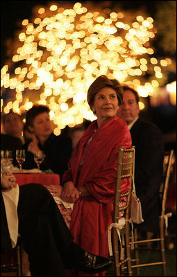 Laura Bush listens to a mariachi band perform during the White House celebration of Cinco de Mayo songs in the Rose Garden of the White House Wednesday, May 4, 2005. 