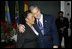 President George W. Bush hugs Coretta Scott King after laying a wreath laying at the grave of Dr. Martin Luther King, Jr. in Atlanta, Georgia, Thursday, Jan. 15, 2004.