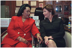 Laura Bush speaks with Coretta Scott King during a Jan. 21, 2002 visit to the Ebenezer Baptist Church in Atlanta, Ga.