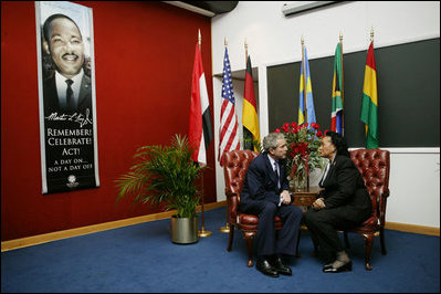 President George W. Bush speaks with Coretta Scott King at the King Center in Atlanta, Georgia, Jan. 15, 2004.