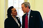 President George W. Bush meets Coretta Scott King in the Oval Office, Feb. 25, 2004.