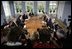 President George W. Bush meets with Danish Prime Minister Anders Fogh Rasmussen, center, left, at his summer residence in Marienborg in Kongens Lyngby, Denmark, Wednesday, July 6, 2005.  "We share the belief that freedom is universal, and we share the belief that in the struggle between democracy and dictatorship, you cannot stay neutral," said Prime Minister Rasmussen. "This is why Denmark contributes with more than 500 troops in Iraq; why we make an active contribution to the joint allied effort in Afghanistan; why we wish to promote democracy and reform in the Middle East; and why we urge all parties to find a peaceful solution to the Arab-Israeli conflict." 