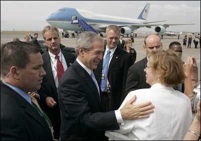 Employees and their children from the American Embassy in Denmark gather to bid farewell to President George W. Bush at Copenhagen's International Airport Wednesday, July 6, 2005.