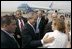 Employees and their children from the American Embassy in Denmark gather to bid farewell to President George W. Bush at Copenhagen's International Airport Wednesday, July 6, 2005.