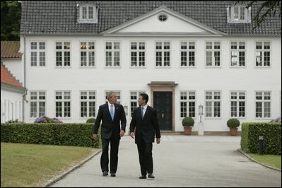 President George W. Bush is greeted by Danish Prime Minister Anders Fogh Rasmussen at his summer residence in Marienborg in Kongens Lyngby, Denmark, Wednesday, July 6, 2005.