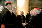 President George W. Bush greets U.S.-based Roman Catholic Cardinals during a reception Thursday, April 7, 2005, in Rome at Villa Taverna, the residence of Mel Sembler, U.S. Ambassador to Italy. From left are: Roger Cardinal Mahony, archbishop of Los Angeles; President Bush; Francis Cardinal George, archbishop of Chicago; Justin Cardinal Rigali, archbishop of Philadelphia, and William Cardinal Keeler, archbishop of Baltimore.