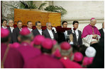 Vatican pallbearers carry the coffin of Pope John Paul II Friday, April 8, 2005, to funeral ceremonies at St. Peter's Square in Rome.