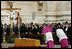 Archbishop Piero Marini, left, master of the liturgical ceremonies, bows to the casket of Pope John Paul II during the Pope's funeral Friday, April 8, 2005, in St. Peter's Square.