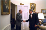 President George W. Bush welcomes Supreme Court Chief Justice William Rehnquist to the Oval Office Dec. 20, 2002. White House photo by Paul Morse