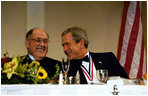 President George W. Bush jokes with Chief Justice William Rehnquist at the Alfalfa Club Dinner in Washington, D.C., Jan. 24, 2004. White House photo by Paul Morse