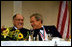 President George W. Bush jokes with Chief Justice William Rehnquist at the Alfalfa Club Dinner in Washington, D.C., Jan. 24, 2004. White House photo by Paul Morse