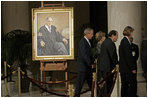 President George W. Bush and Laura Bush walk with Justice Antonin Scalia and Sally Rider, the Chief Justice's assistant, after viewing a portrait of Chief Justice William Rehnquist as his body lies in repose in the Great Hall of the U.S. Supreme Court Tuesday, Sept. 6, 2005. White House photo by Eric Draper