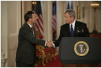 President George W. Bush shakes hands with his Supreme Court Justice Nominee John Roberts after his remarks on the State Floor of the White House, Tuesday evening, July 19, 2005.