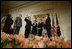 President George W. Bush, left, looks on during the swearing-in ceremony for U.S. Supreme Court Justice Samuel A. Alito, Tuesday, Feb. 1, 2006 in the East Room of the White House, sworn-in by U.S. Supreme Court Chief Justice John Roberts. Altio's wife, Martha-Ann, their son Phil and daughter, Laura, are seen center-background.