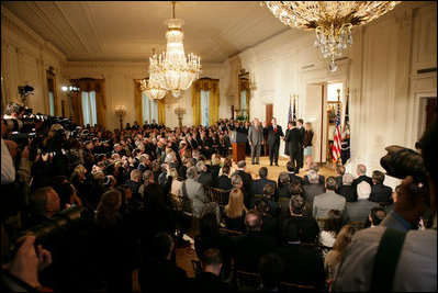 President George W. Bush looks on during the swearing-in ceremony for U.S. Supreme Court Justice Samuel A. Alito, Tuesday, Feb. 1, 2006 in the East Room of the White House, sworn-in by U.S. Supreme Court Chief Justice John Roberts. Altio's wife, Martha-Ann, their son Phil and daughter, Laura, are seen center-background.