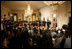 President George W. Bush looks on during the swearing-in ceremony for U.S. Supreme Court Justice Samuel A. Alito, Tuesday, Feb. 1, 2006 in the East Room of the White House, sworn-in by U.S. Supreme Court Chief Justice John Roberts. Altio's wife, Martha-Ann, their son Phil and daughter, Laura, are seen center-background.