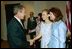 President George W. Bush greets Elizabeth Smart, center, and her mother Lois Smart in the Roosevelt Room Wednesday, April 30, 2003. President Bush met with the Smart family before the signing of the S. 151, PROTECT Act of 2003. 