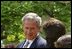 President George W. Bush looks toward Lacy Lyons, center, before signing the S. 151, PROTECT Act of 2003, in the Rose Garden Wednesday, April 30, 2003. Abducted by their father, Lacy, 10, and her sister Nyoka, 8, left, were found after an AMBER alert was activated throughout the state of Florida. 