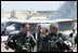 President George W. Bush walks across the tarmac with NFO Lt. Ryan Phillips to Navy One, an S-3B Viking jet, at Naval Air Station North Island in San Diego Thursday, May 1, 2003. Flying to the USS Abraham Lincoln, the President will address the nation and spend the night aboard ship.