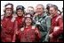 President George W. Bush poses with flight deck crew of the USS Abraham Lincoln May 1, 2003.