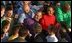 President George W. Bush greets sailors after addressing the nation on the flight deck of the USS Abraham Lincoln off the coast of San Diego, California May 1, 2003.