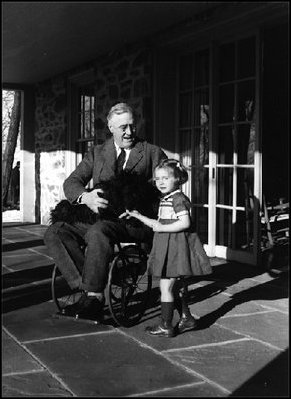 President Franklin D. Roosevelt (1933-45) introduces his Scottish terrier, Fala, to a young girl. 