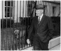 President Dwight Eisenhower walks by Heidi, his Weimaraner, as he returns to the White House following a press conference on March 11, 1959 at the Executive Office Building, which today is named the Eisenhower Executive Office Building in memory of the 34th president.