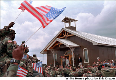 After addressing the troops, President Bush signed in legislation adding 1.9 billion dollars to the defense budget to provide increased pay, benefits and health care for America's armed forces. 