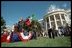 President Bush pledges allegiance during the playing of the National Anthem as Mexican President Vicente Fox stands at attention during the State Arrival Ceremony on the White House South Lawn Sept. 6.