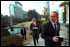 President George W. Bush and White House Chief of Staff Andy Card (center), take their morning coffee in the garden at the residence of United States' ambassador Howard Baker in Tokyo, Monday, Feb. 18, 2002. White House photo by Eric Draper.